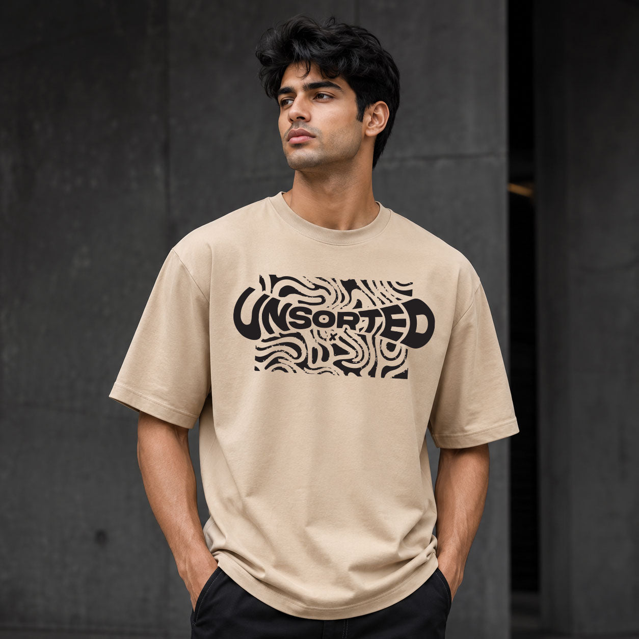 UNSORTED oversized tee in sand — front view with topographic print