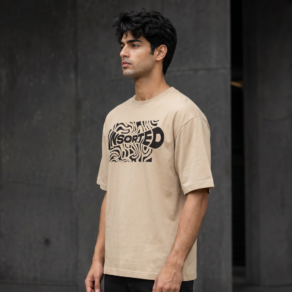 UNSORTED oversized tee in sand — right side profile