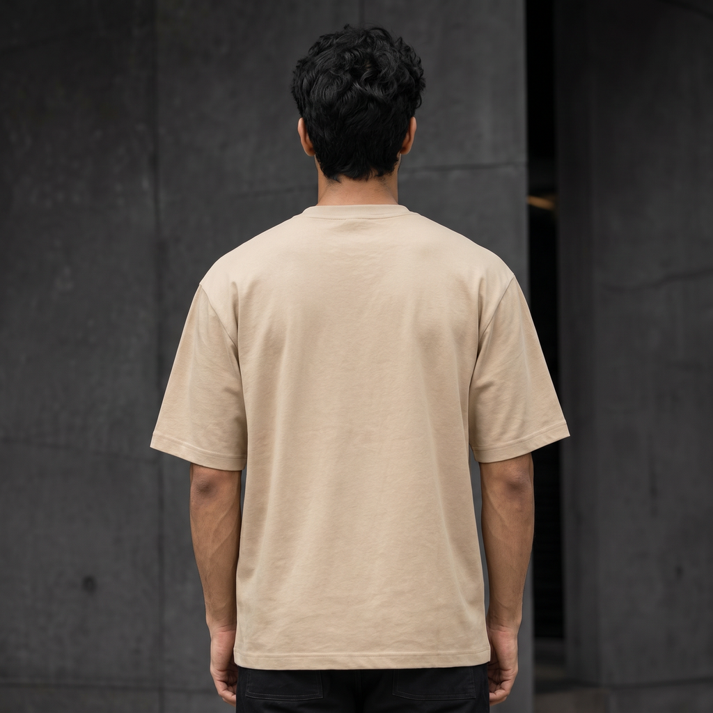 UNSORTED oversized tee in sand — back view