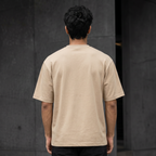 UNSORTED oversized tee in sand — back view